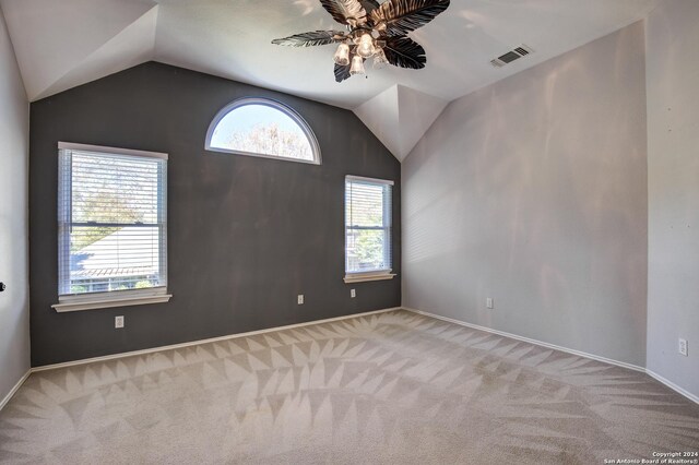 268 Fawn Rdg, Cibolo, TX 78108 - spare room with vaulted ceiling, carpet flooring, a ceiling fan, and baseboards