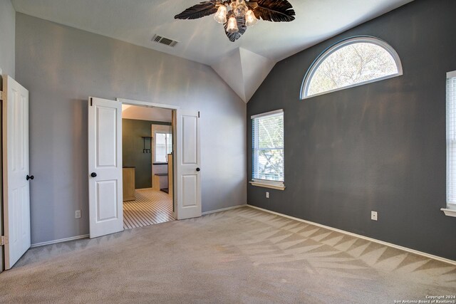 268 Fawn Rdg, Cibolo, TX 78108 - unfurnished bedroom with carpet floors, lofted ceiling, a ceiling fan, baseboards, and connected bathroom