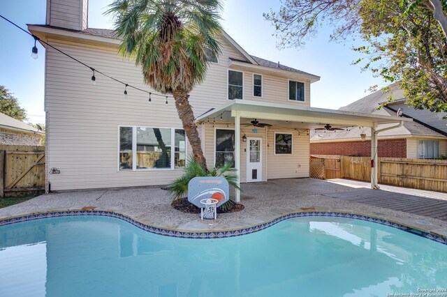 268 Fawn Rdg, Cibolo, TX 78108 - rear view of house with a ceiling fan, a fenced backyard, a patio area, and a chimney
