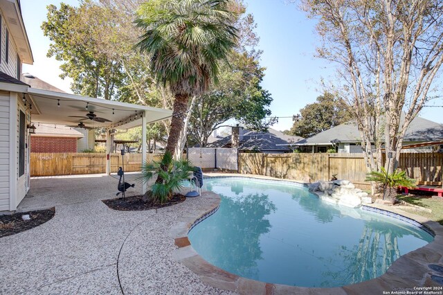 268 Fawn Rdg, Cibolo, TX 78108 - view of swimming pool featuring ceiling fan, a patio, and a fenced backyard