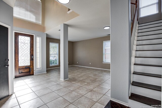268 Fawn Rdg, Cibolo, TX 78108 - entryway featuring stairs, plenty of natural light, and light tile patterned floors