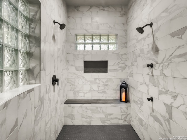 bathroom featuring tiled shower