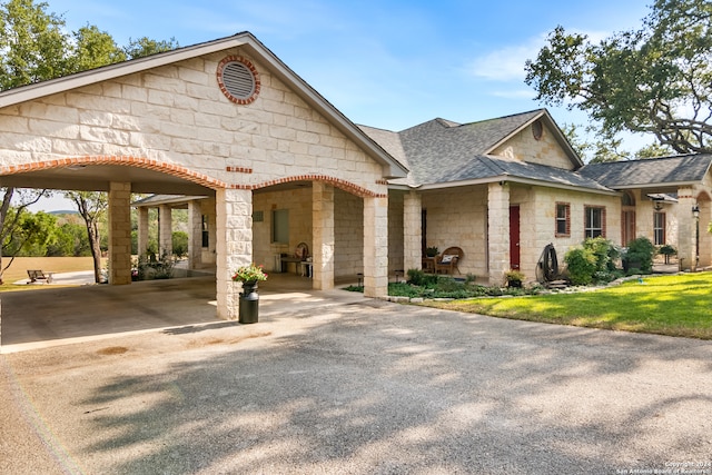 view of front of property featuring a carport