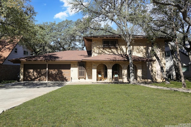 traditional-style home featuring driveway, a front yard, brick siding, and an attached garage