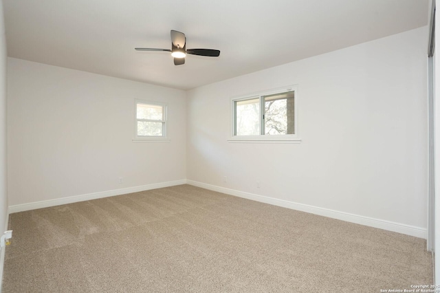 unfurnished room with baseboards, carpet floors, and ceiling fan