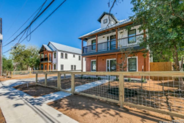 view of front of property with a balcony