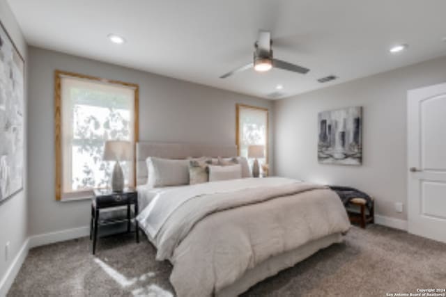 carpeted bedroom featuring ceiling fan