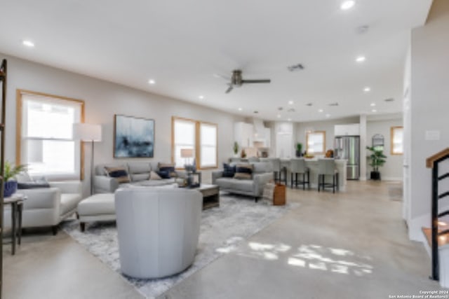 living room featuring ceiling fan