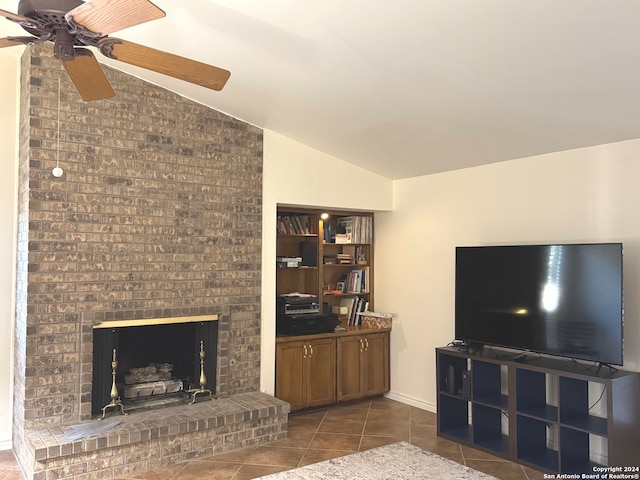 tiled living room with a brick fireplace, ceiling fan, and lofted ceiling