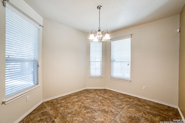 empty room with a chandelier