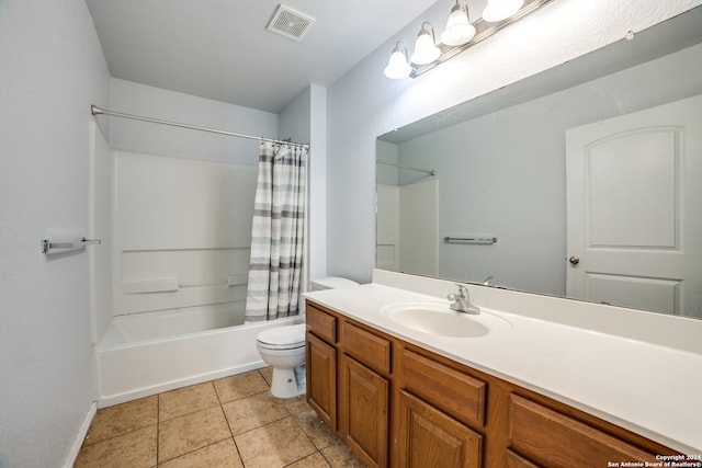 full bathroom with tile patterned floors, vanity, shower / tub combo, and toilet