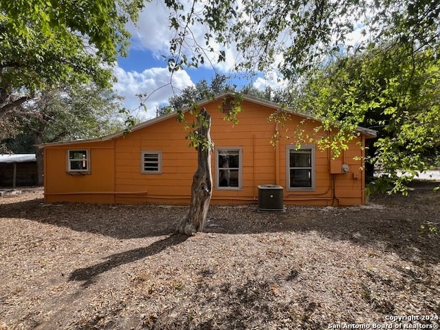 back of house with cooling unit