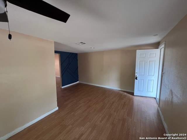 spare room featuring hardwood / wood-style floors