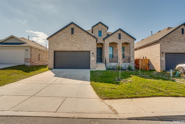 12303 Tower Frst, San Antonio, TX 78253 - french country style house featuring brick siding, concrete driveway, and a garage