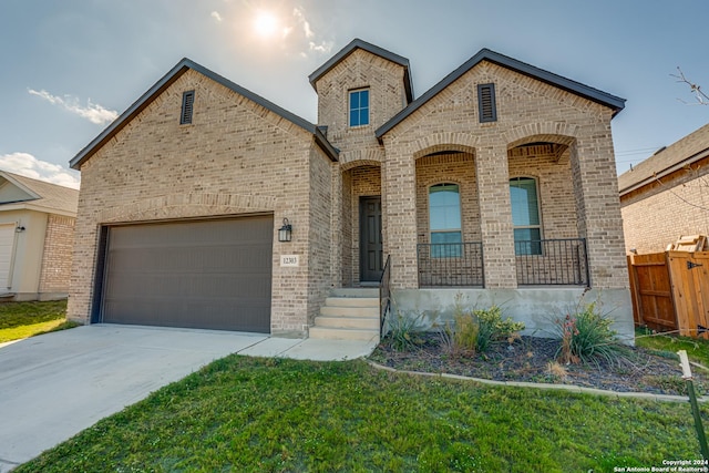 12303 Tower Frst, San Antonio, TX 78253 - french country home featuring brick siding, a garage, and concrete driveway