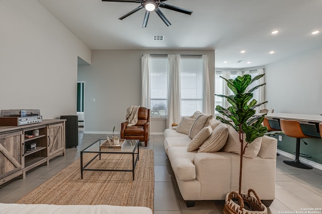 tiled living room featuring ceiling fan