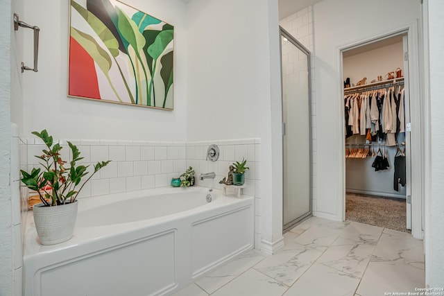 12303 Tower Frst, San Antonio, TX 78253 - full bath with a bath, a shower stall, a spacious closet, and marble look tile flooring