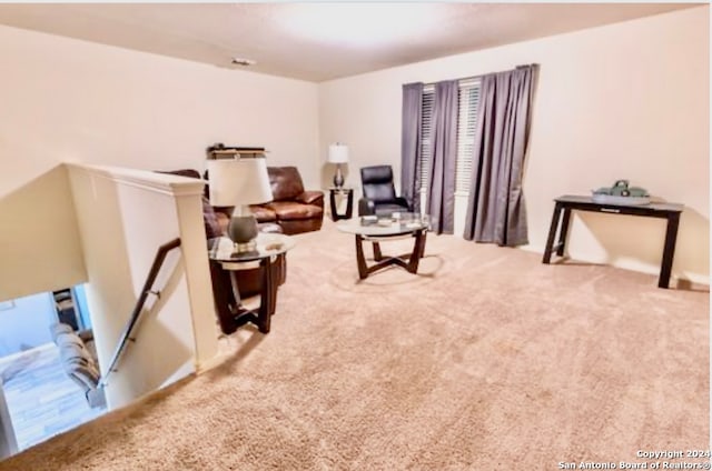 sitting room with light colored carpet