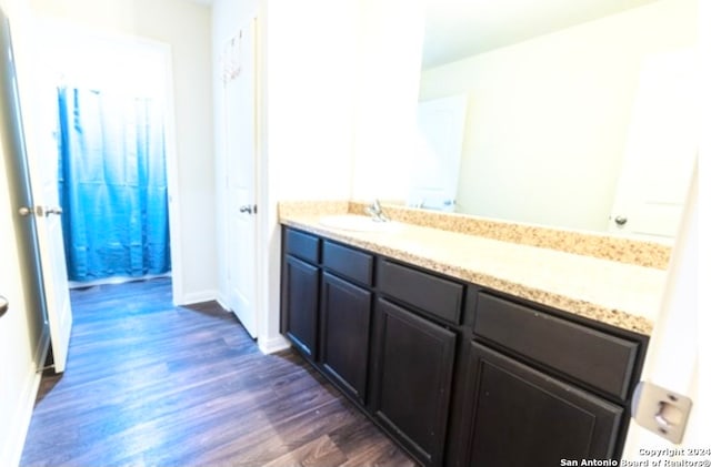 bathroom featuring hardwood / wood-style floors and vanity