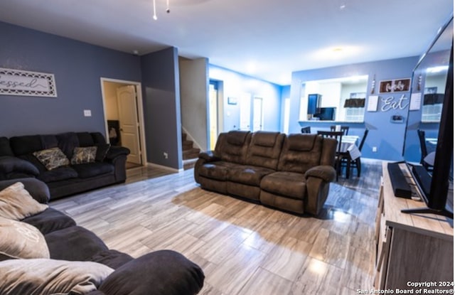 living room with light hardwood / wood-style flooring