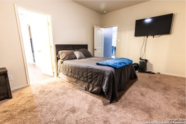 bedroom with light colored carpet