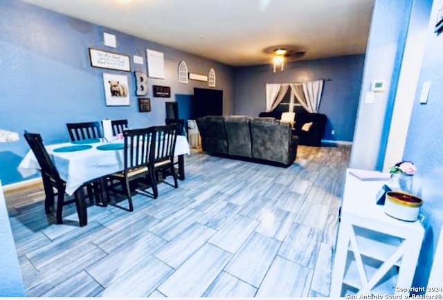 dining room with wood-type flooring