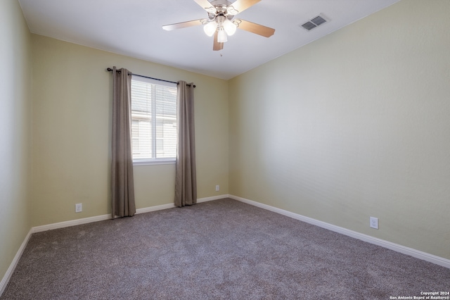 empty room with carpet flooring and ceiling fan