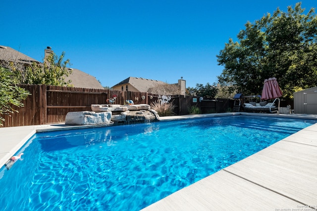 view of pool with pool water feature