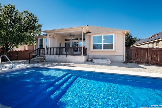 view of swimming pool featuring ceiling fan