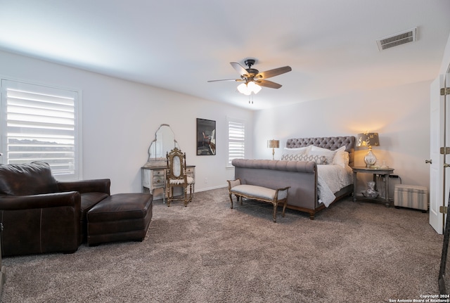 bedroom featuring dark colored carpet and ceiling fan