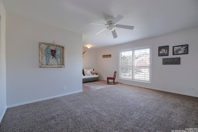 unfurnished room with ceiling fan and carpet floors