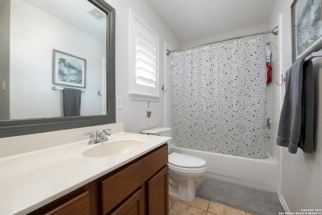 full bathroom featuring tile patterned floors, shower / bathtub combination with curtain, vanity, and toilet