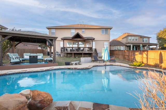 view of pool with outdoor lounge area and a gazebo