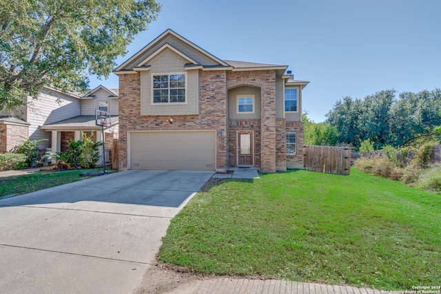 view of front of house featuring a front lawn and a garage