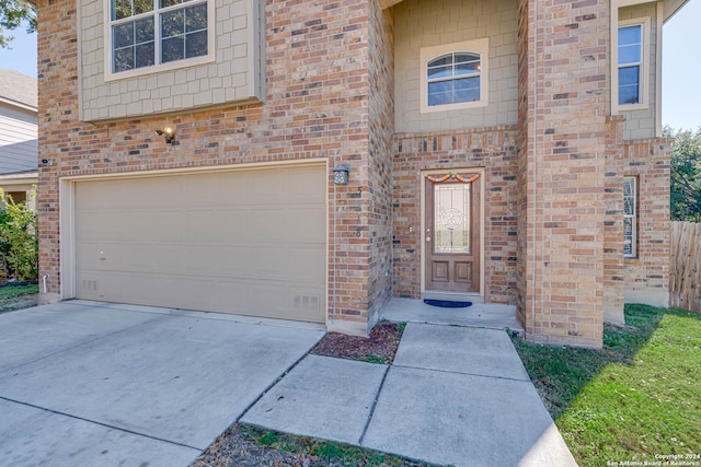 property entrance with a garage