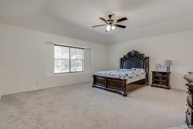 bedroom with ceiling fan and light carpet