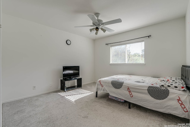 bedroom featuring ceiling fan and light colored carpet