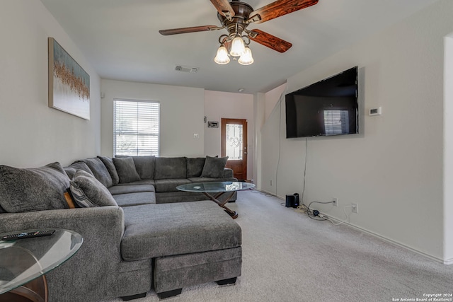 living room featuring ceiling fan and light colored carpet