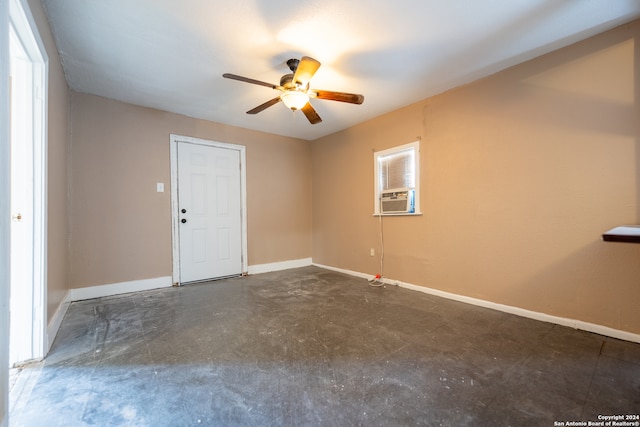 unfurnished room featuring ceiling fan and cooling unit