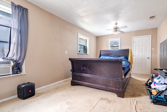 bedroom featuring light carpet and ceiling fan