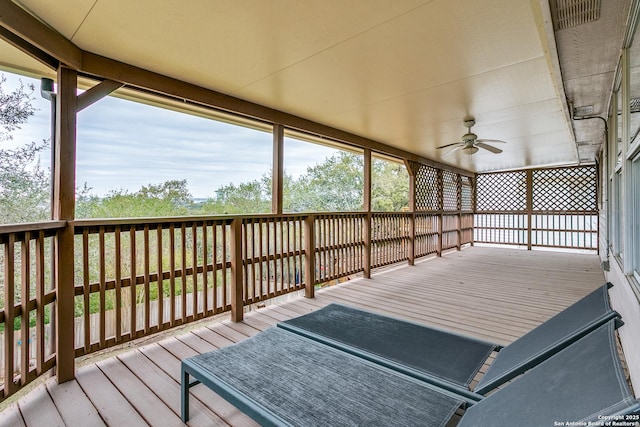 wooden deck with ceiling fan