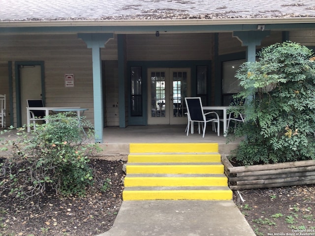 property entrance with french doors and covered porch