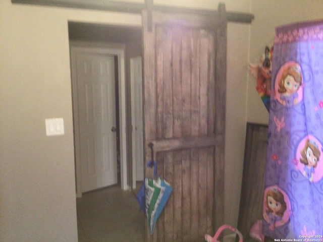 interior space featuring a barn door