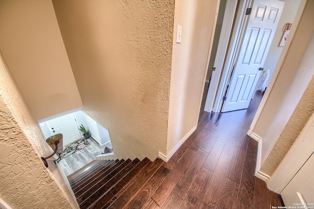 corridor featuring dark hardwood / wood-style floors