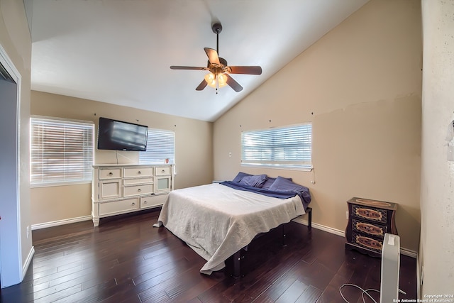 bedroom featuring ceiling fan, dark wood-type flooring, and high vaulted ceiling