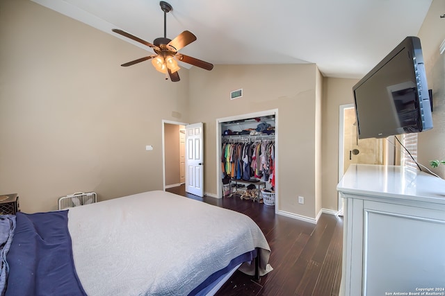 bedroom with high vaulted ceiling, a closet, dark wood-type flooring, and ceiling fan