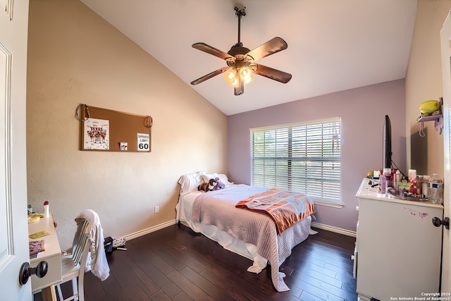 bedroom with vaulted ceiling, ceiling fan, and dark hardwood / wood-style floors