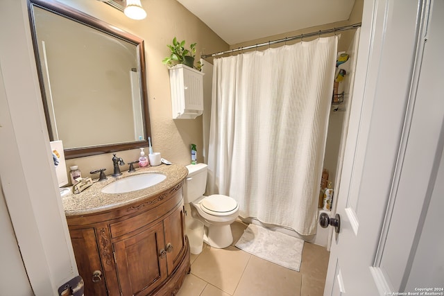 bathroom featuring tile patterned floors, vanity, curtained shower, and toilet