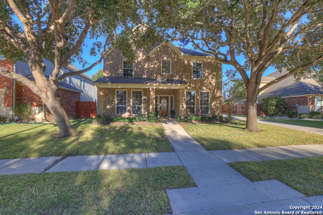 front facade featuring a front yard