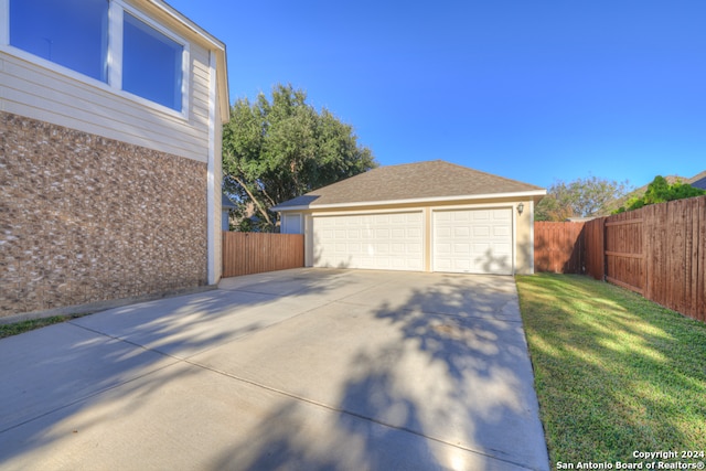 garage with a lawn